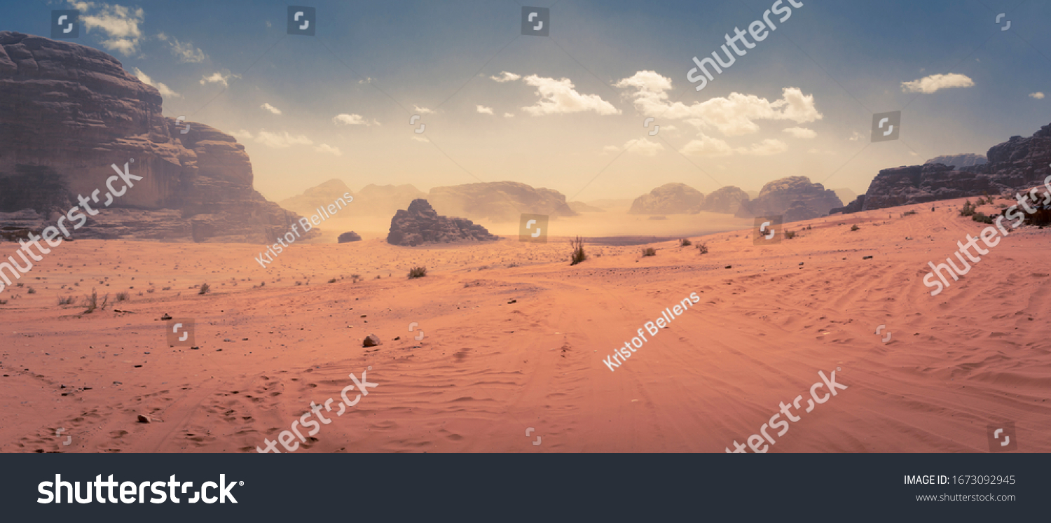 Panorama of the Wadi Rum desert in Jordan during a slight sand storm #1673092945