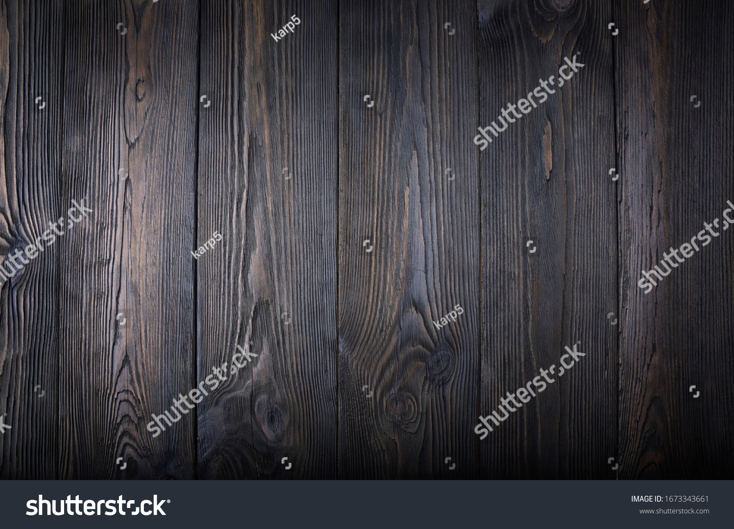 An old dark wooden table. Background #1673343661