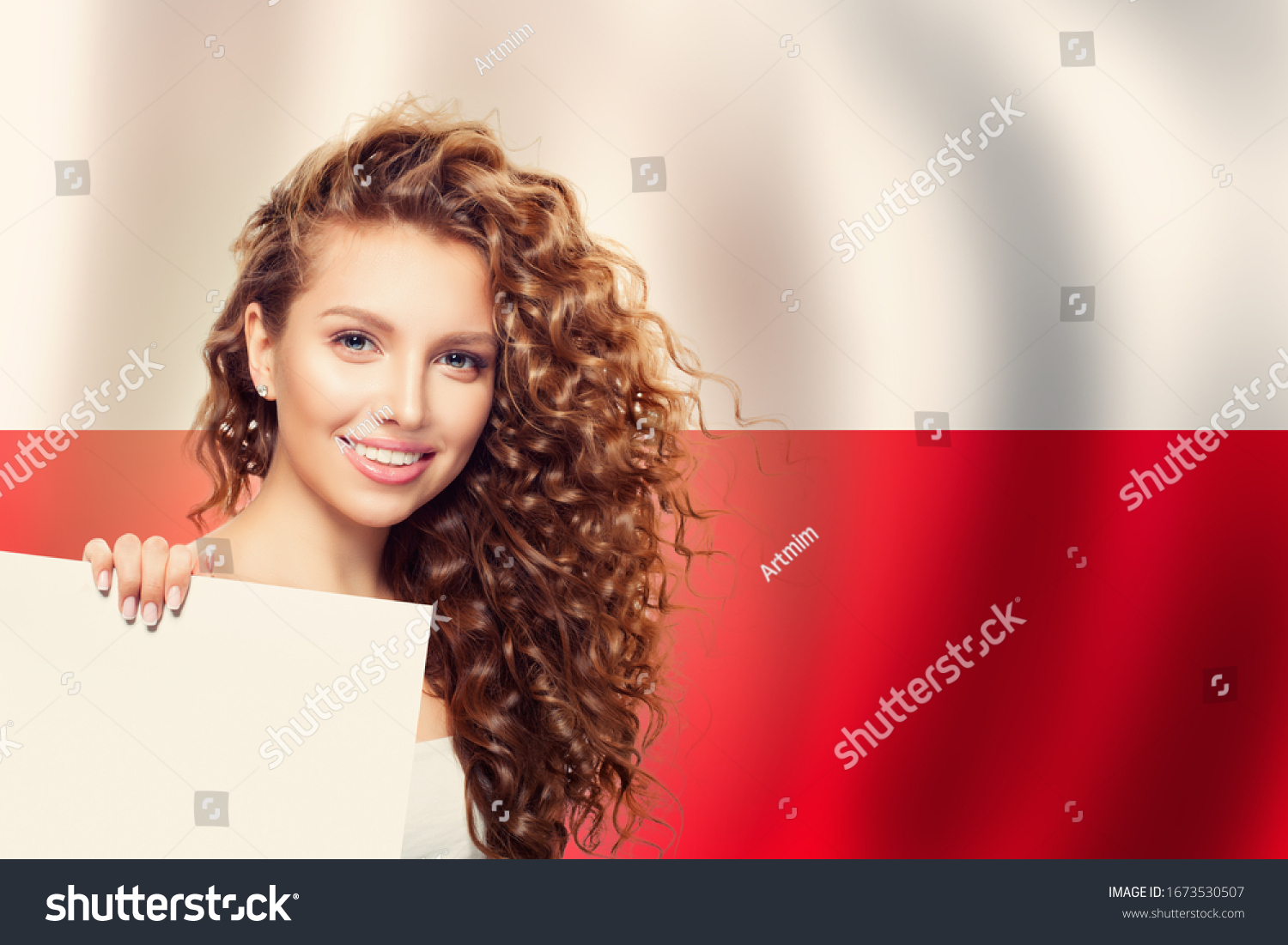 Cute young woman showing white paper on the Poland flag background. Travel and learn polish language concept #1673530507