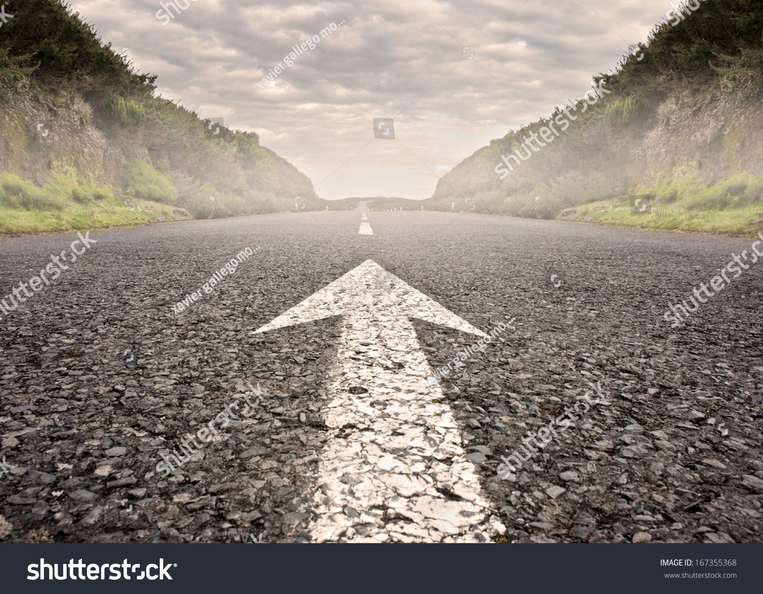 arrow on asphalt road to the horizon #167355368