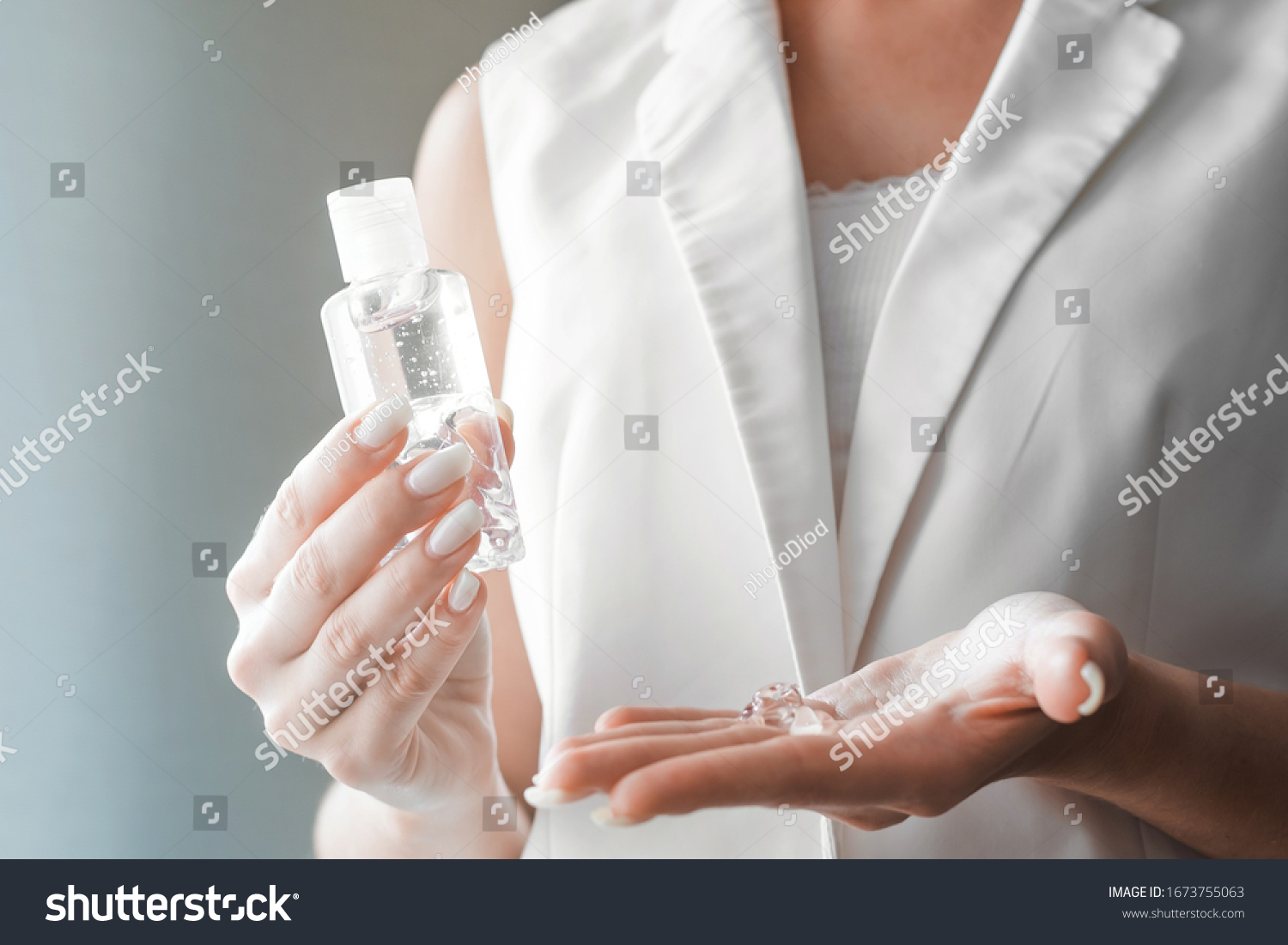 Women washing hands with antibacterial sanitizer gel. Hygiene concept. Prevent the spread of germs and bacteria and avoid infections corona virus. #1673755063