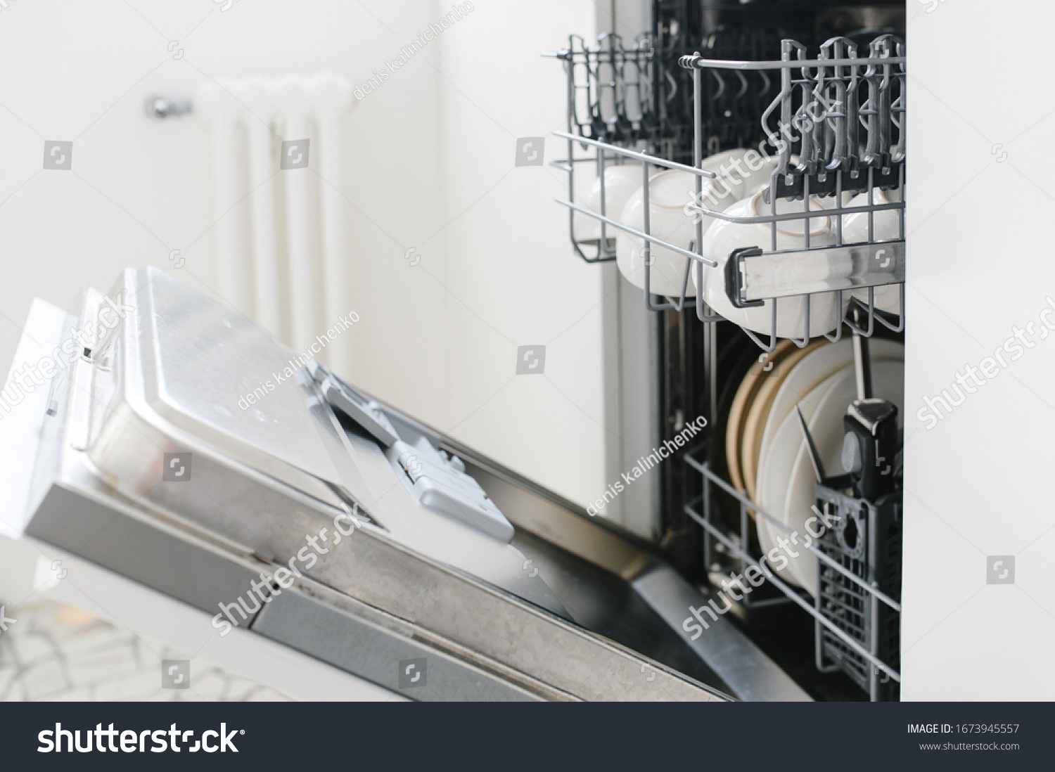 open dishwasher with clean dishes at home kitchen #1673945557