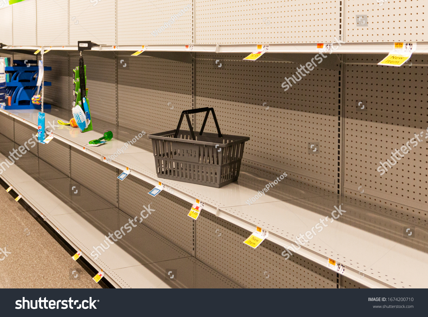 Grocery store shelves are empty due to panic buying caused for the caronavirus pandemic. #1674200710