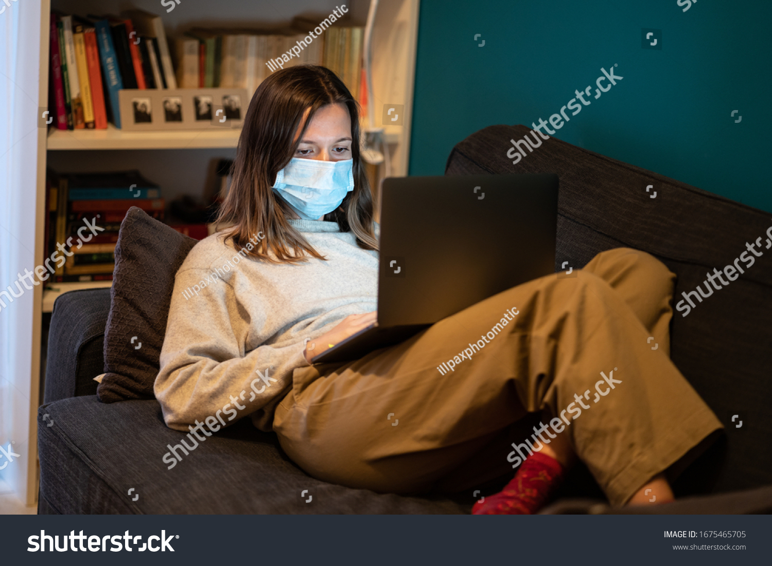 A white girl is working from home during Coronavirus or Covid-19 quarantine, coronavirus covid 19 infected patient in coronavirus covid 19 quarantine room using computer #1675465705