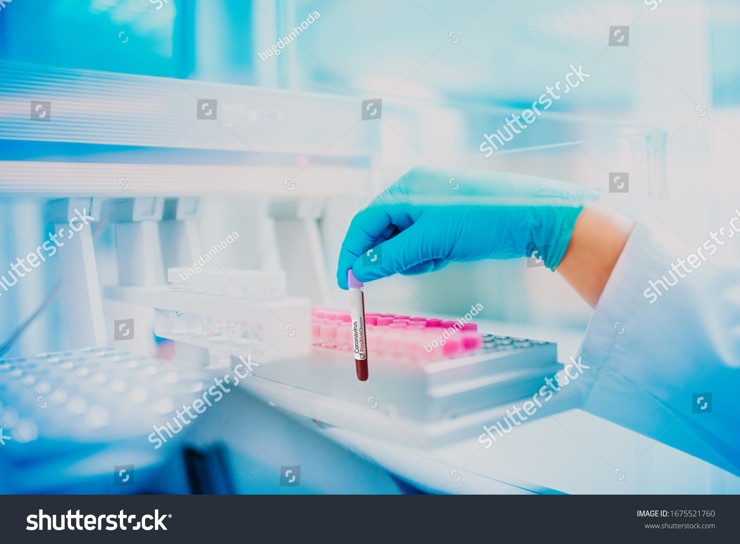 Medical doctor holding a positive test tube with blood for covid19, analyzing blood. #1675521760
