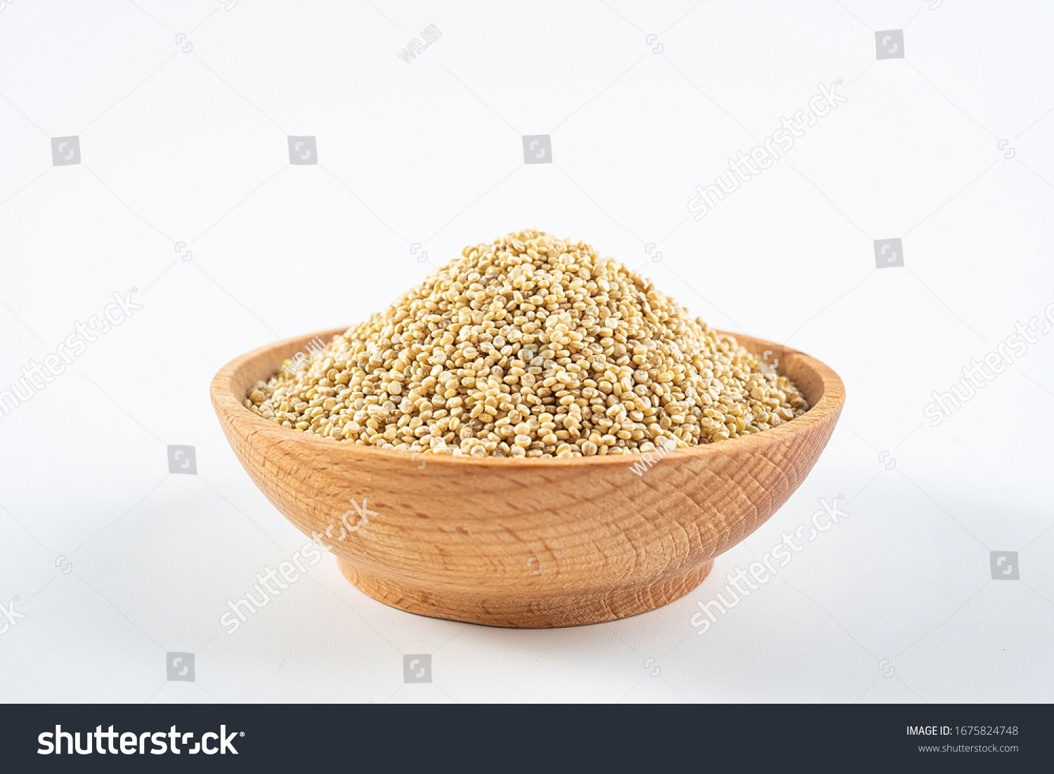 A wooden bowl of miscellaneous grains buckwheat on a white background	
 #1675824748