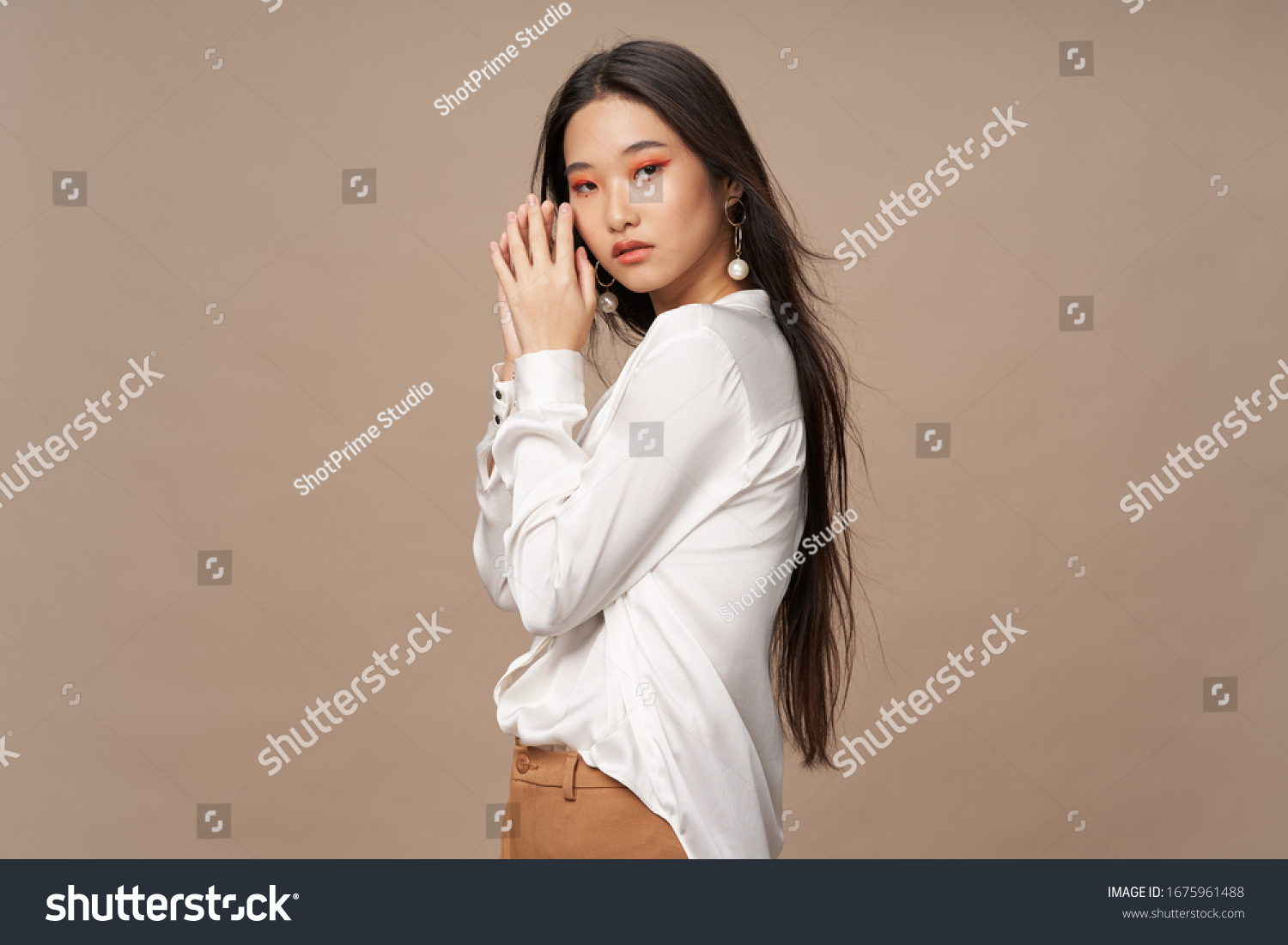 Beige background white shirt beautiful woman dark hair #1675961488