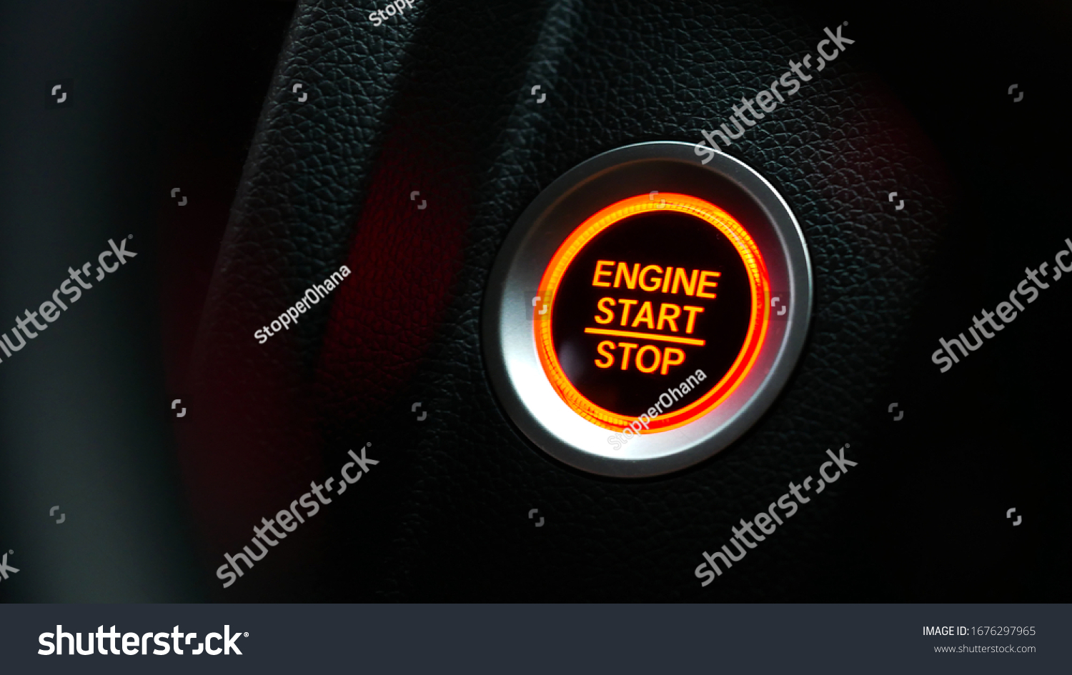 Car dashboard with focus on red engine start stop button, car interior details. button engine start and engine stop, Car engine push start stop button ignition remote starter. #1676297965