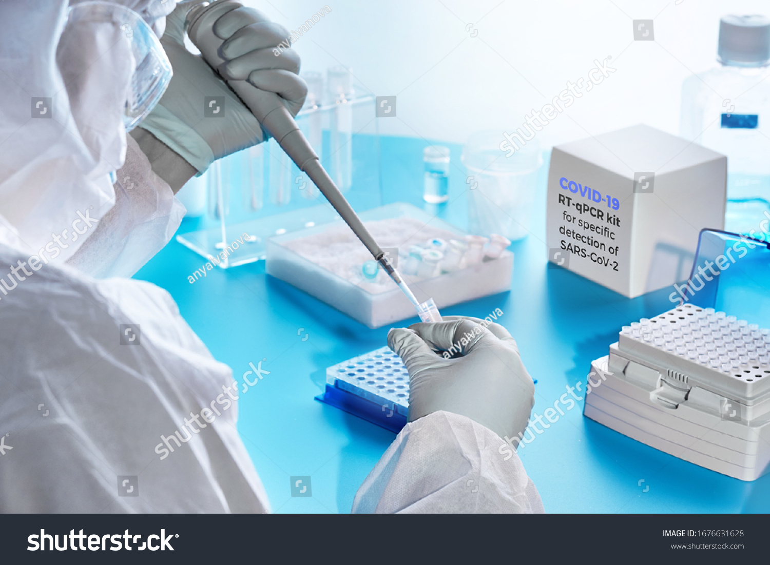 SARS-COV-2 pcr diagnostics kit. Epidemiologist in protective suit, mask and glasses performs pcr tests to detect specific region of SARS-nCoV-2 virus, cause of Covid-19 viral pneumonia.