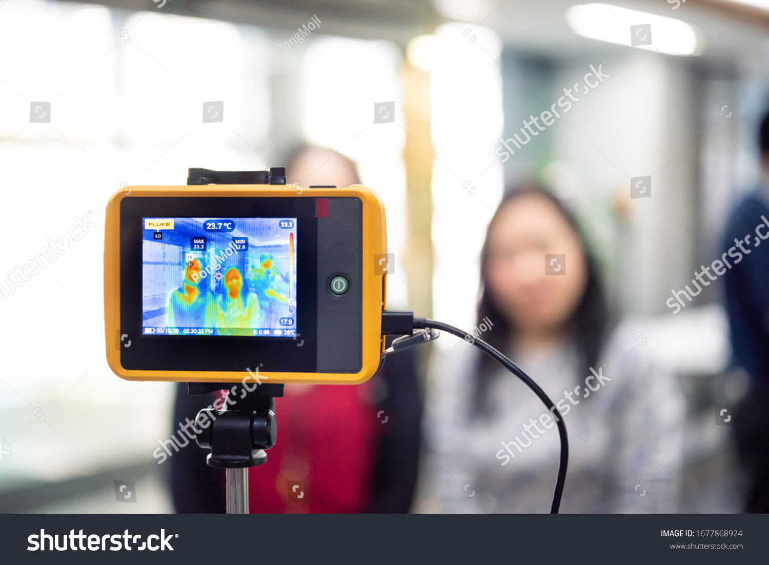 Asian people waiting for body temperature check before access to building for against epidemic flu covid19 or corona virus from wuhan in office by thermoscan or infrared thermal camera #1677868924