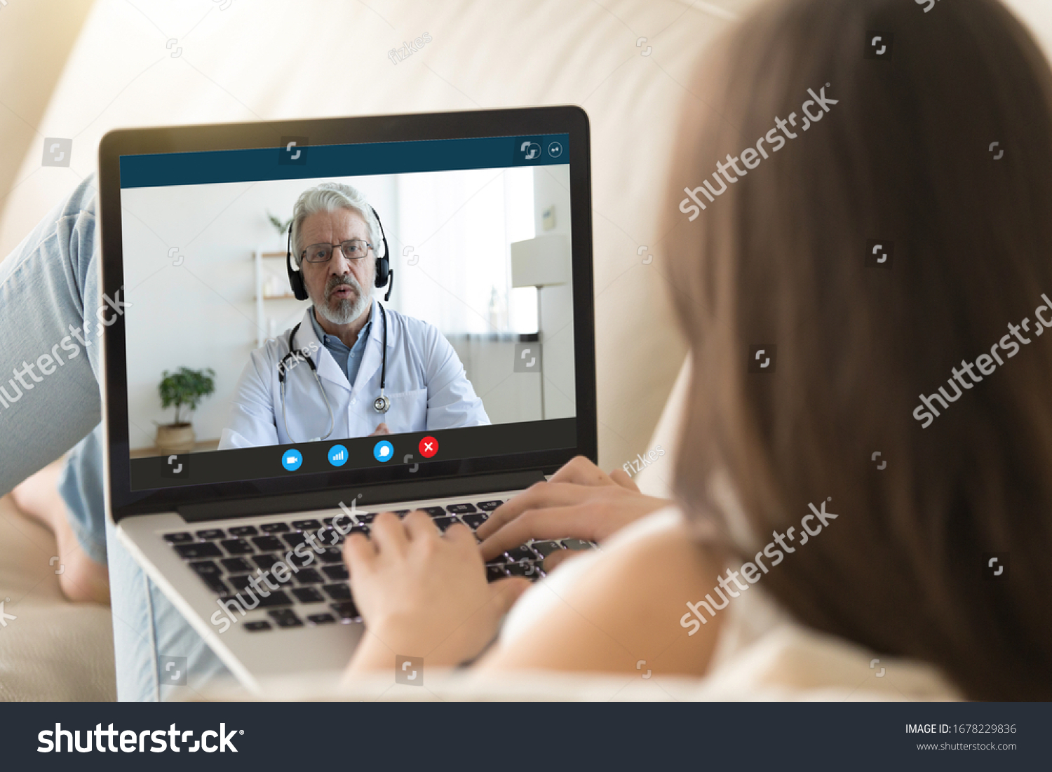 Pc monitor view over girl shoulder, old doctor wear uniform headset give consultation to client via internet about epidemic outbreak of corona virus ncov, distant communication and protection concept #1678229836