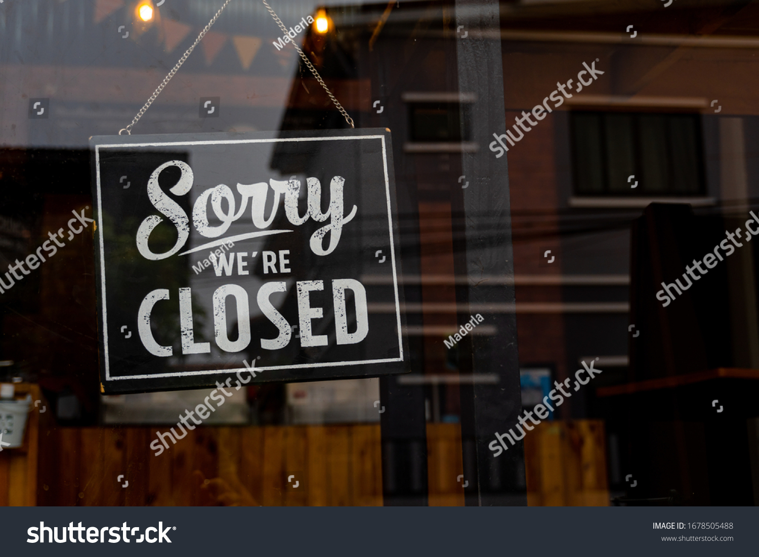 Sorry we're closed . vintage black and white retro sign on a coffee glass door #1678505488