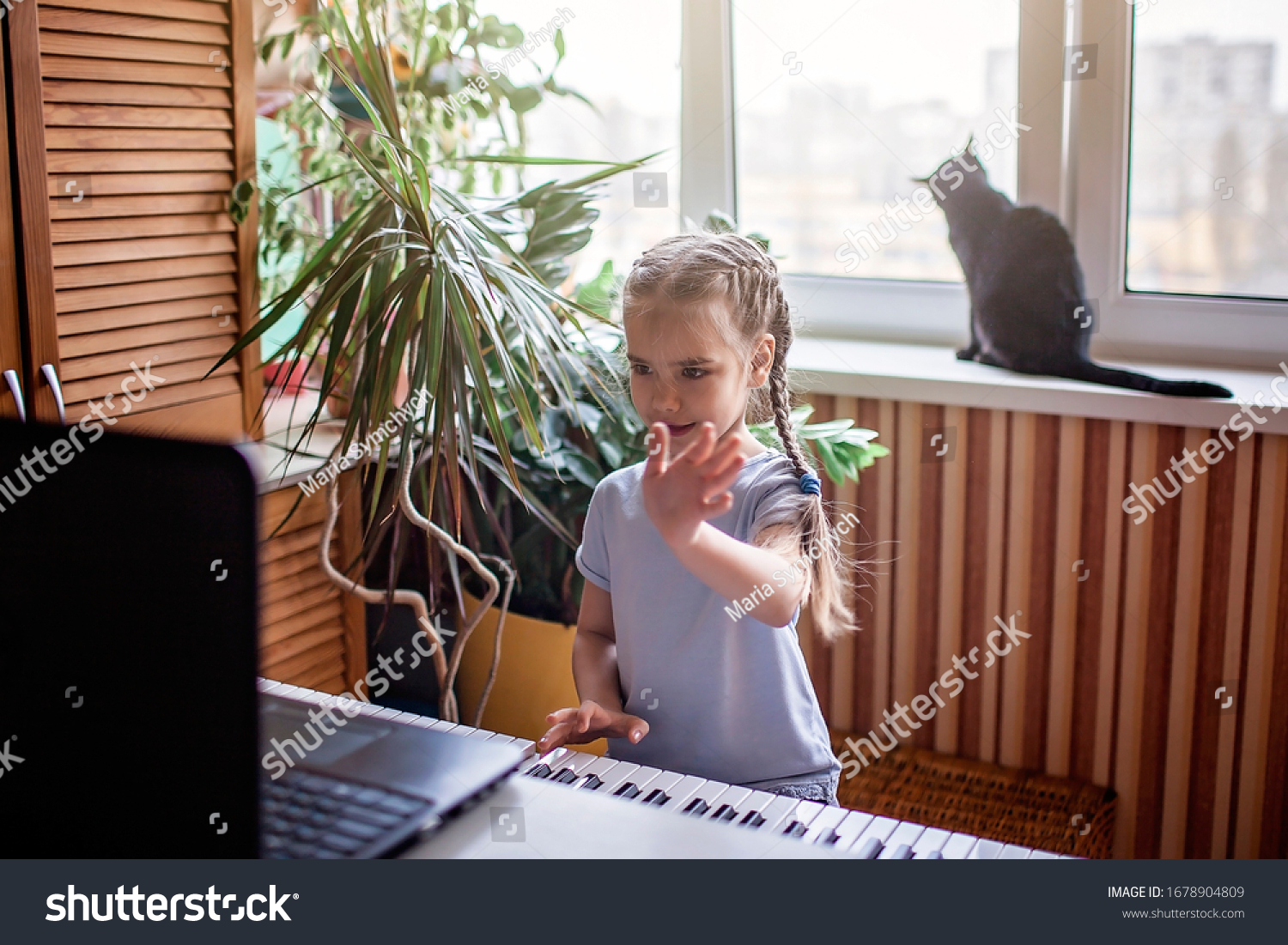 Pretty young musician playing classic digital piano at home during online class at home, social distance during quarantine, self-isolation, online education concept #1678904809