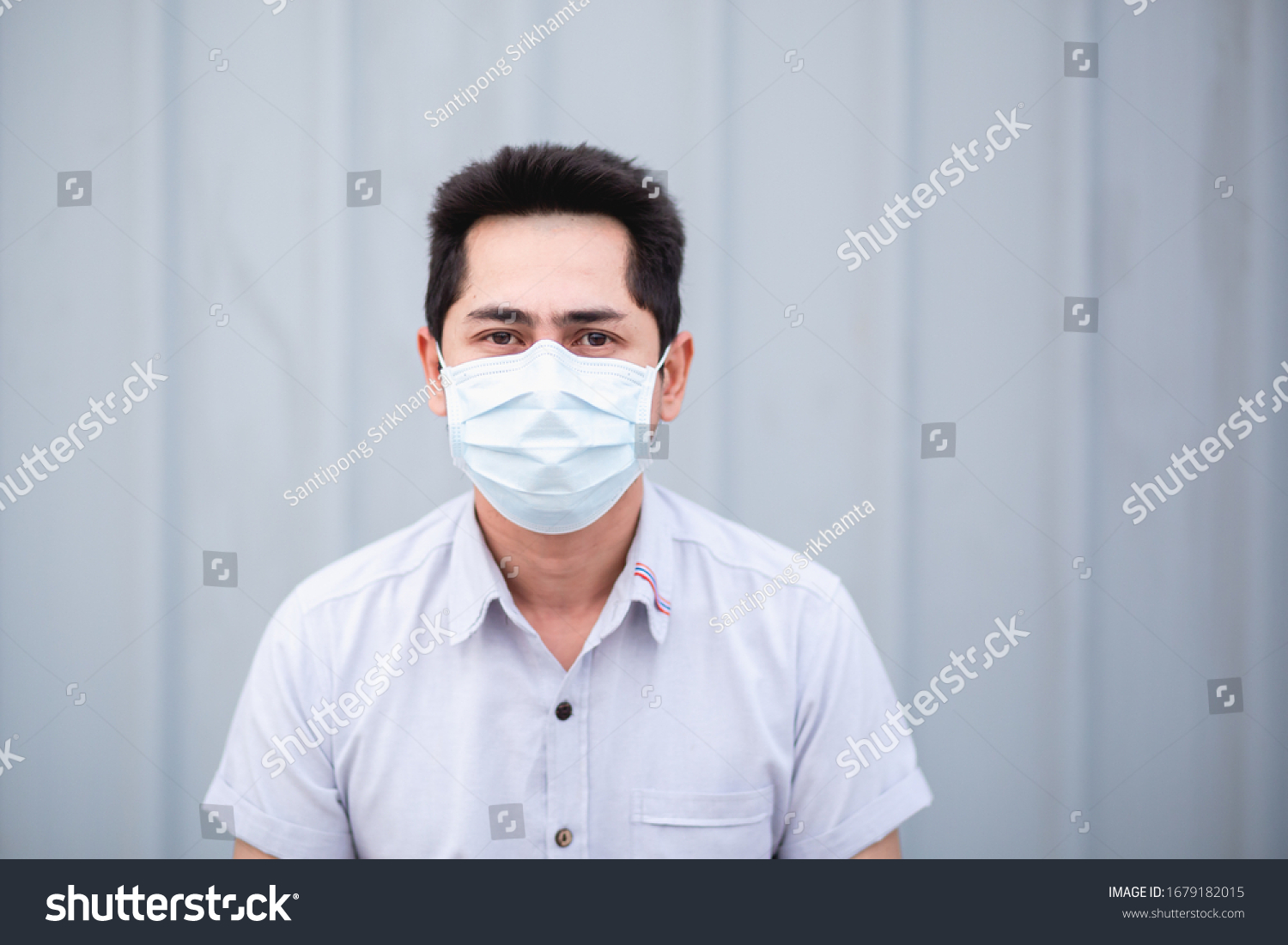 Protect self from virus. Asian man wearing face mask to protect himself from any virus or pollution.  #1679182015