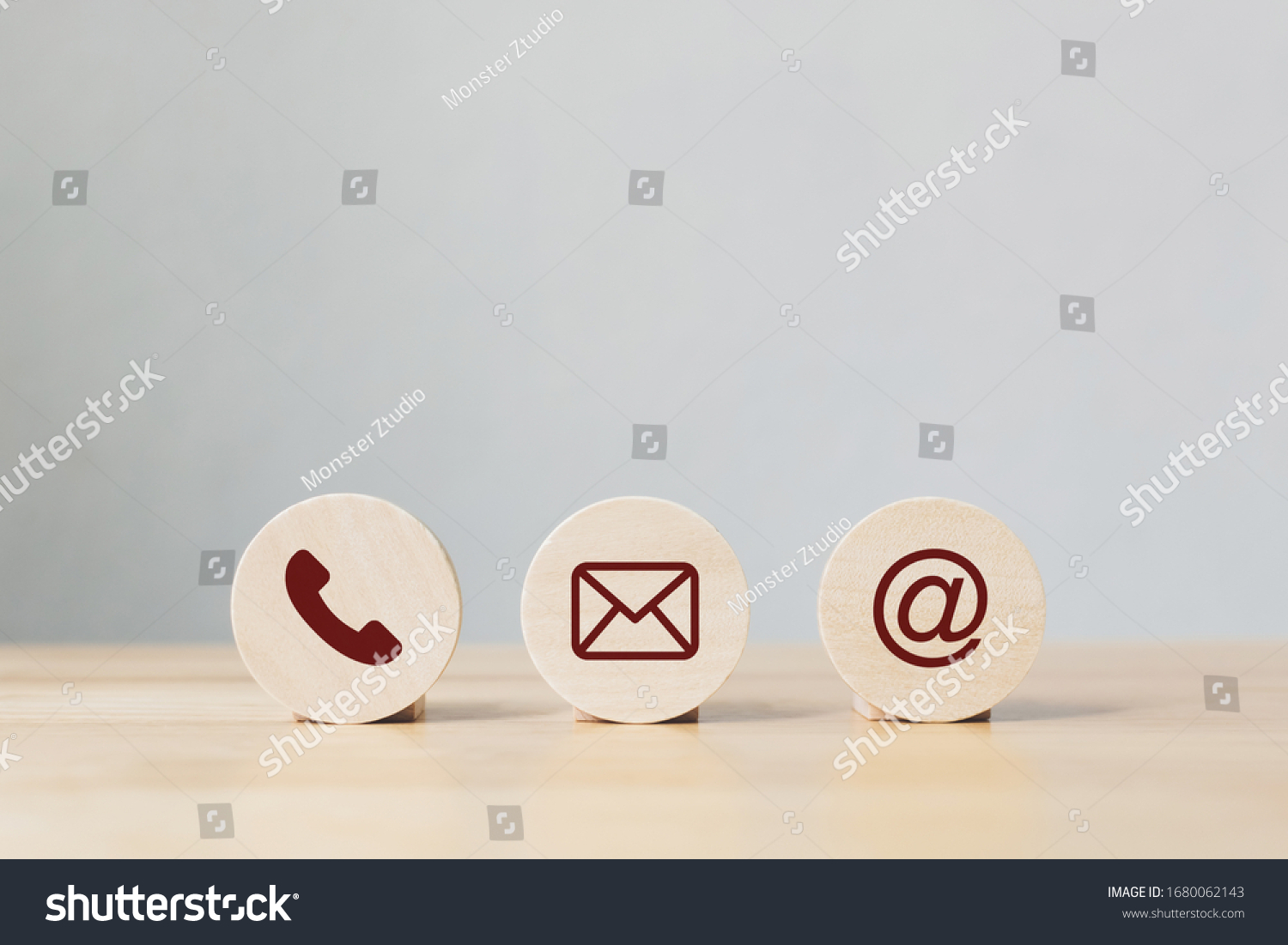 Wooden coins with symbol telephone, email, address. Website page contact us or e-mail marketing concept #1680062143