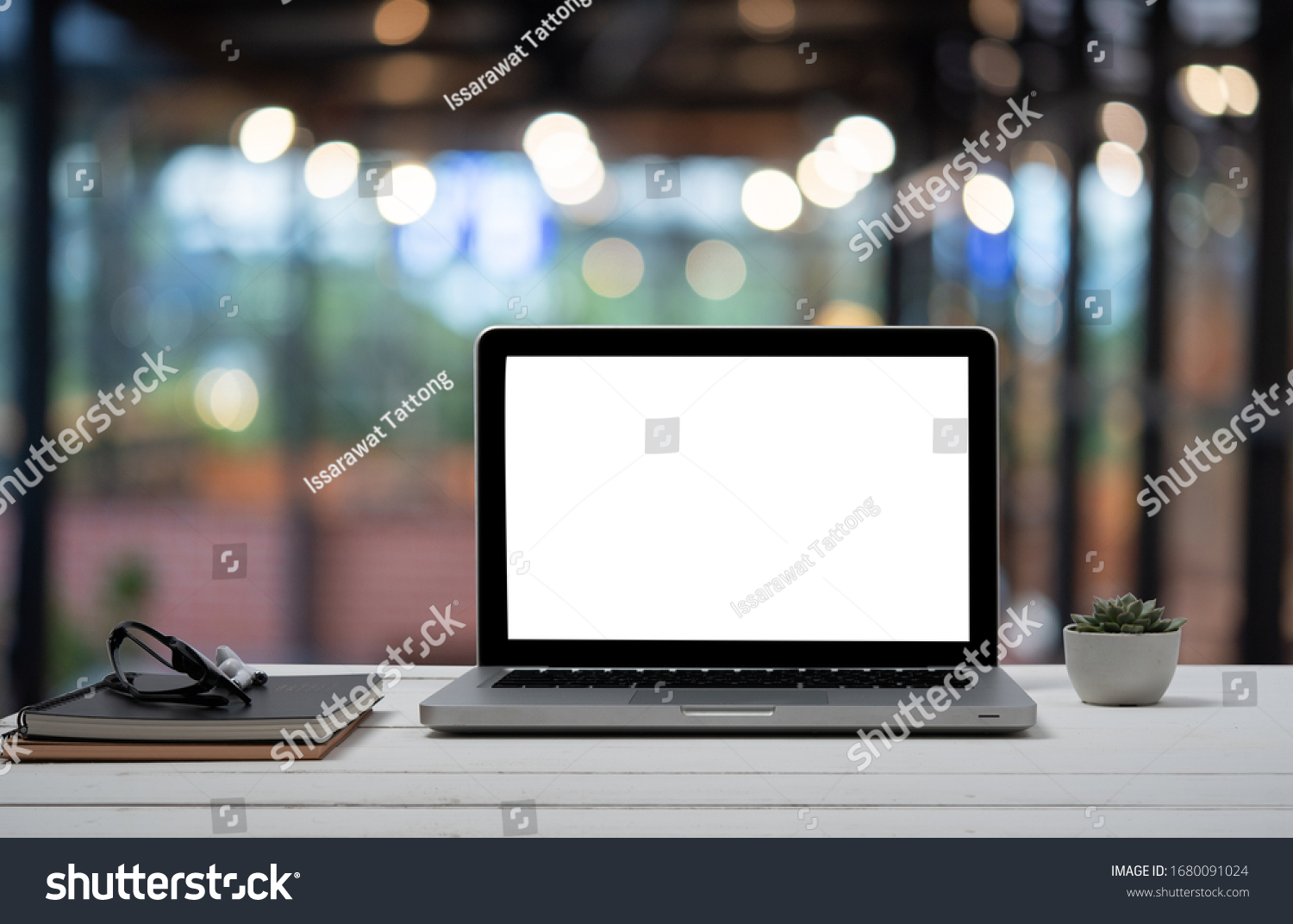 Laptop with blank screen and smartphone on table. #1680091024