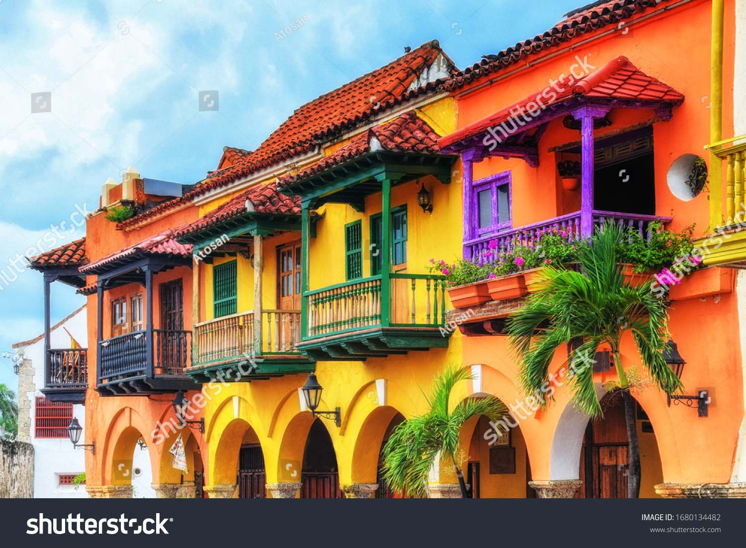 Colorful spanish colonial buildings with wooden balconies at Plaza de los Coches inside the walled city of Cartagena de Indias, Colombia. UNESCO world heritage site. #1680134482
