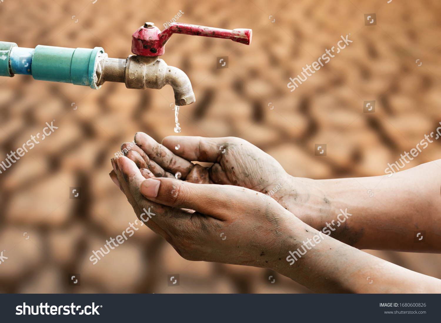 Hand of people wating for a drip of water from a faucet at desert. Climate change, water scarcity and crisis concept. #1680600826