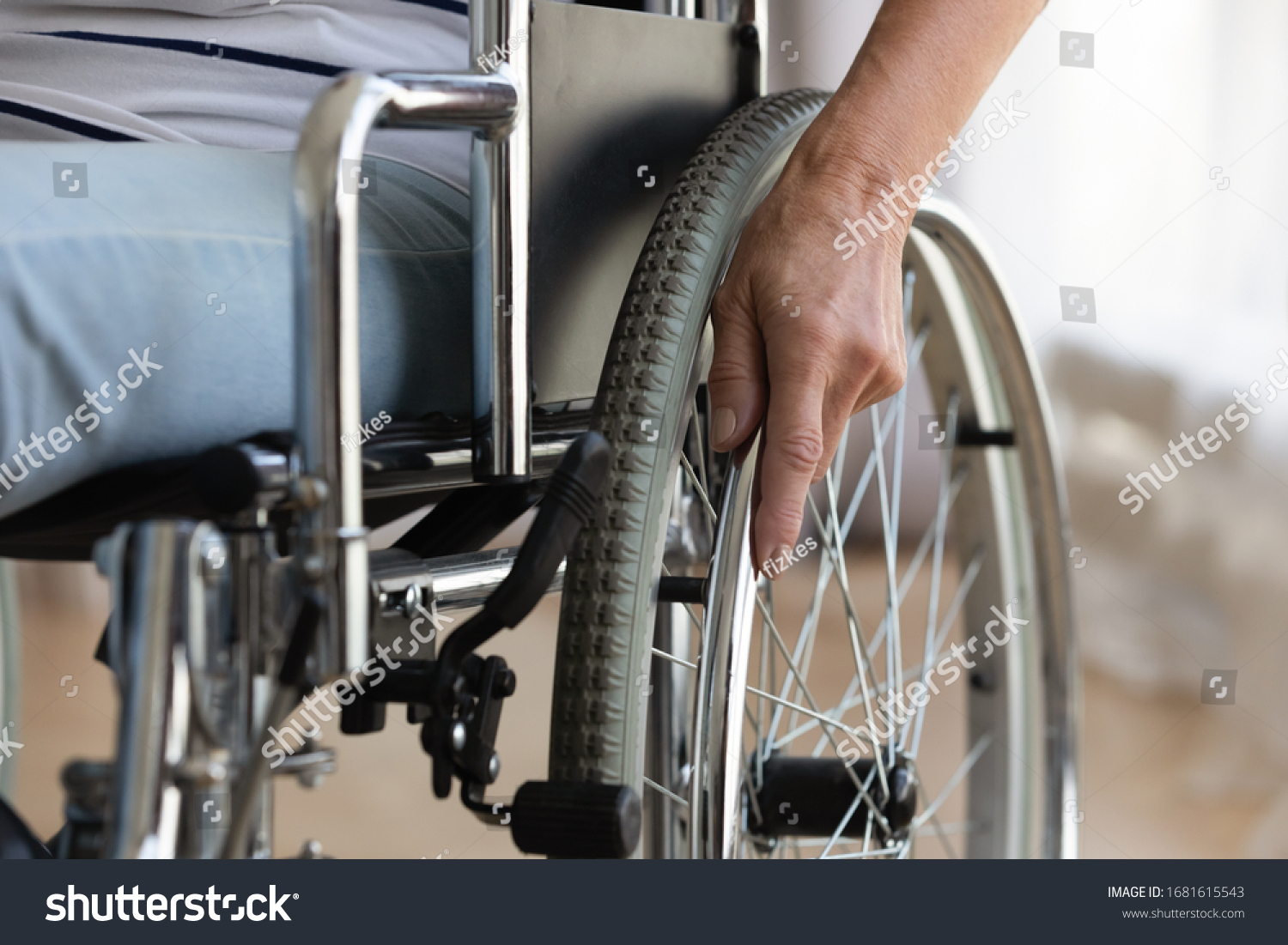 Close up of senior handicapped woman sit in wheelchair taken care of in hospital or home, mature disabled old lady grandmother in invalid carriage or wheel chair, elderly disability concept #1681615543