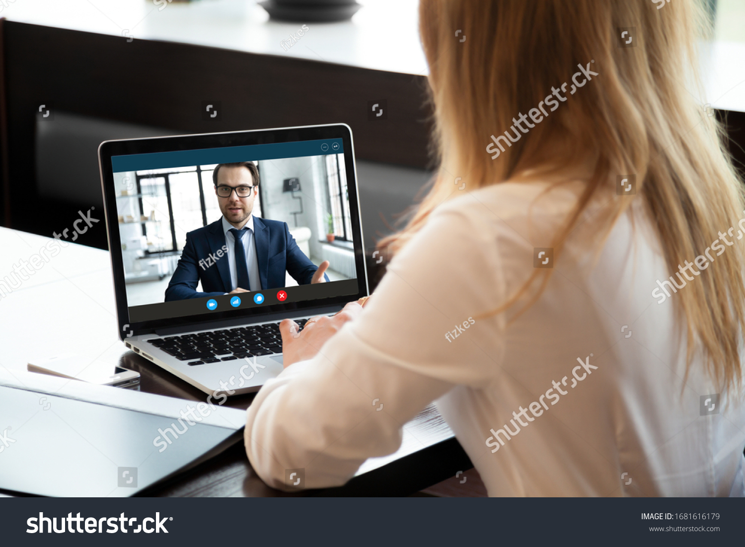 Back view of young businesswoman talk with male business partner using video call on modern laptop, female employee speak consult with businessman on webcam conference, online consultation concept #1681616179