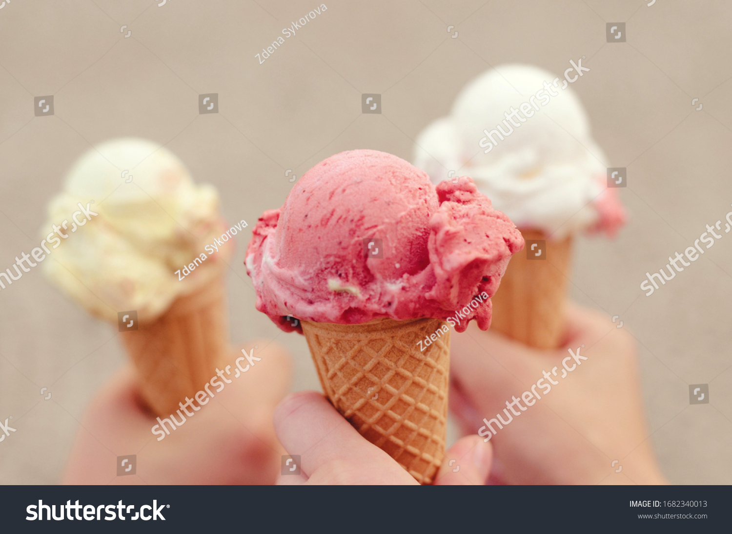 Three cornets of ice cream - strawberry, vanilla, lemon #1682340013