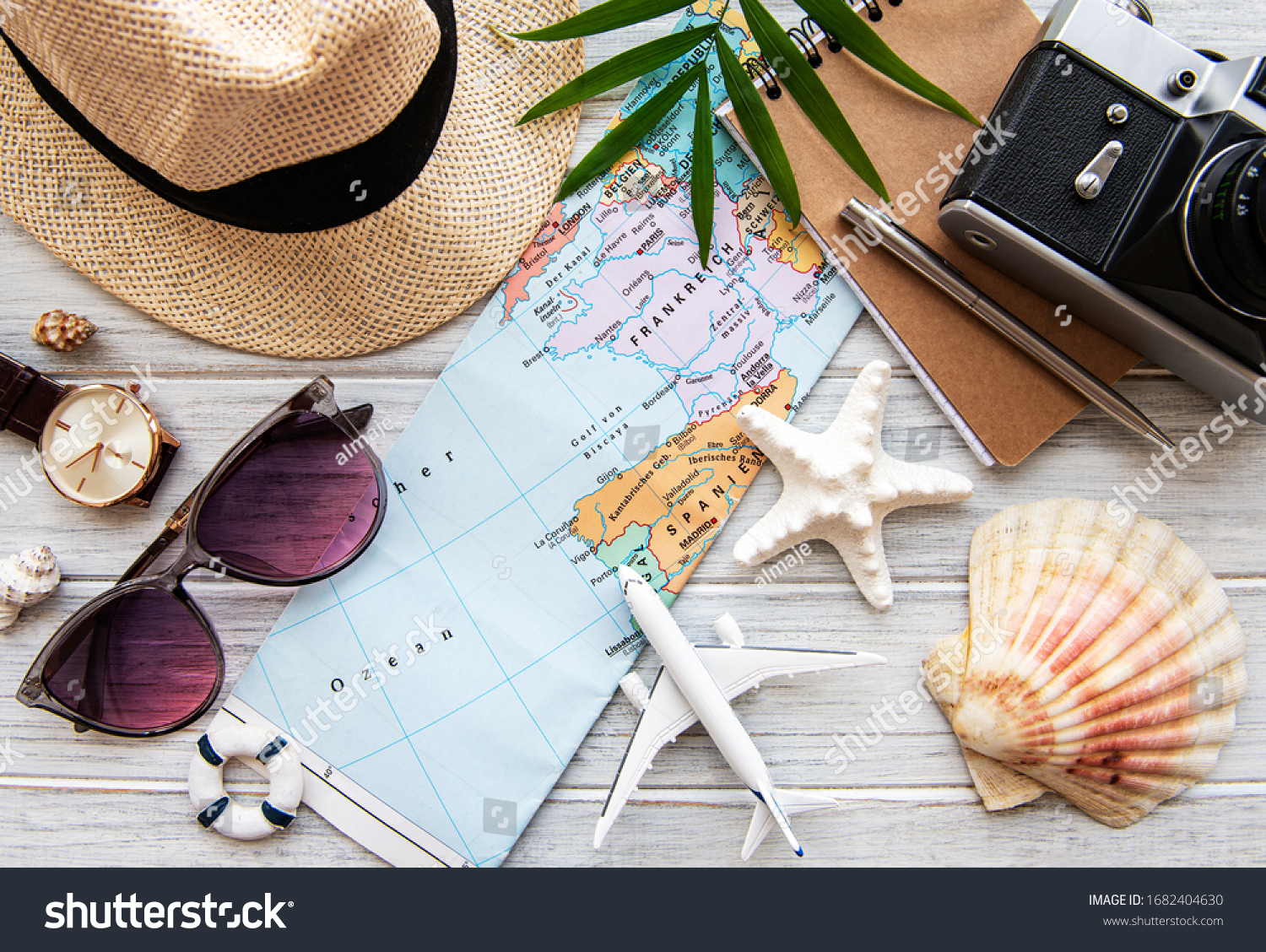 Overhead view of Traveler's accessories. Essential vacation items. Travel concept background. Flat lay #1682404630
