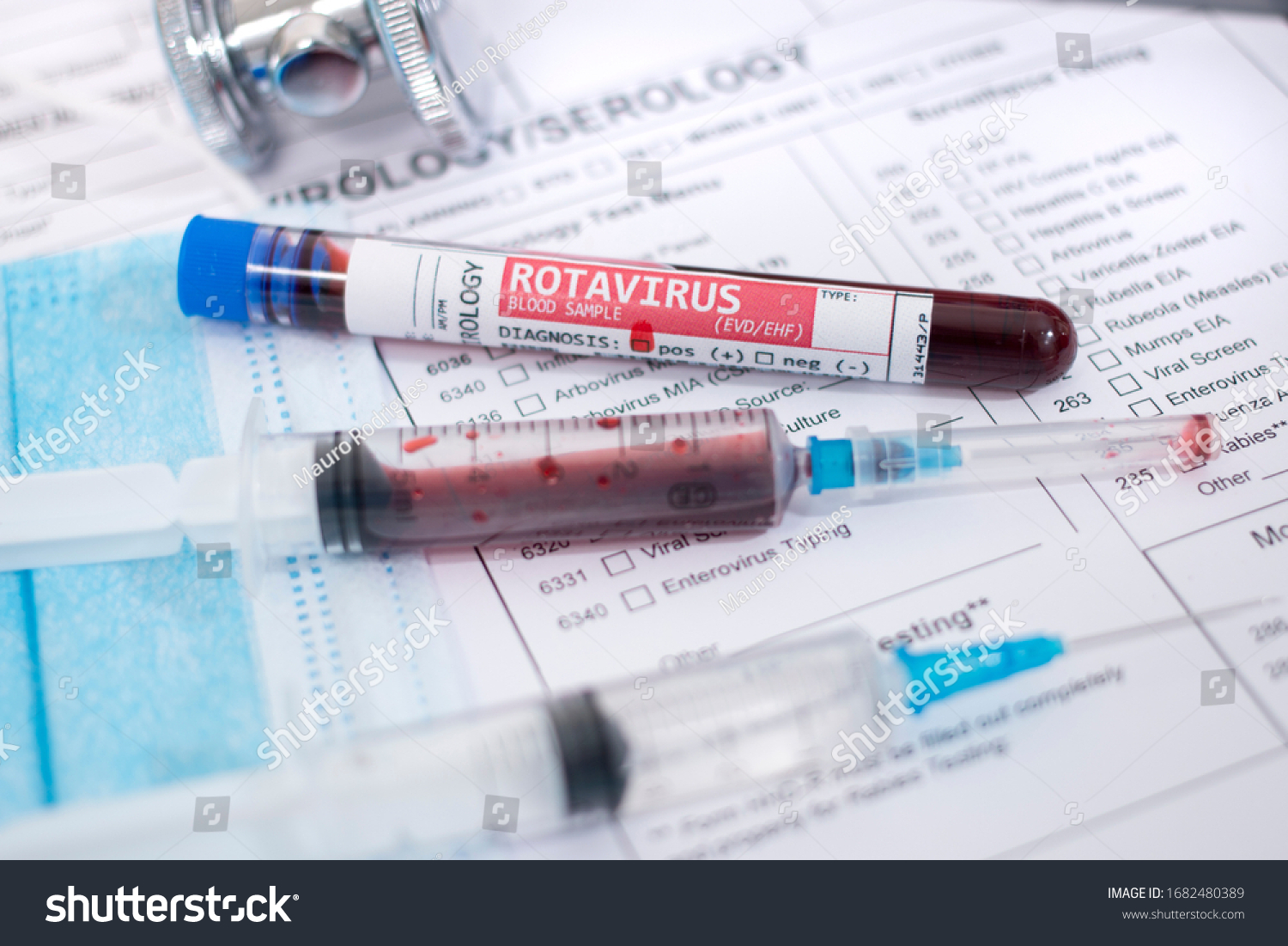 Fictional Blood samples with infected Rotavirus, with mask, syringe and lab report. #1682480389