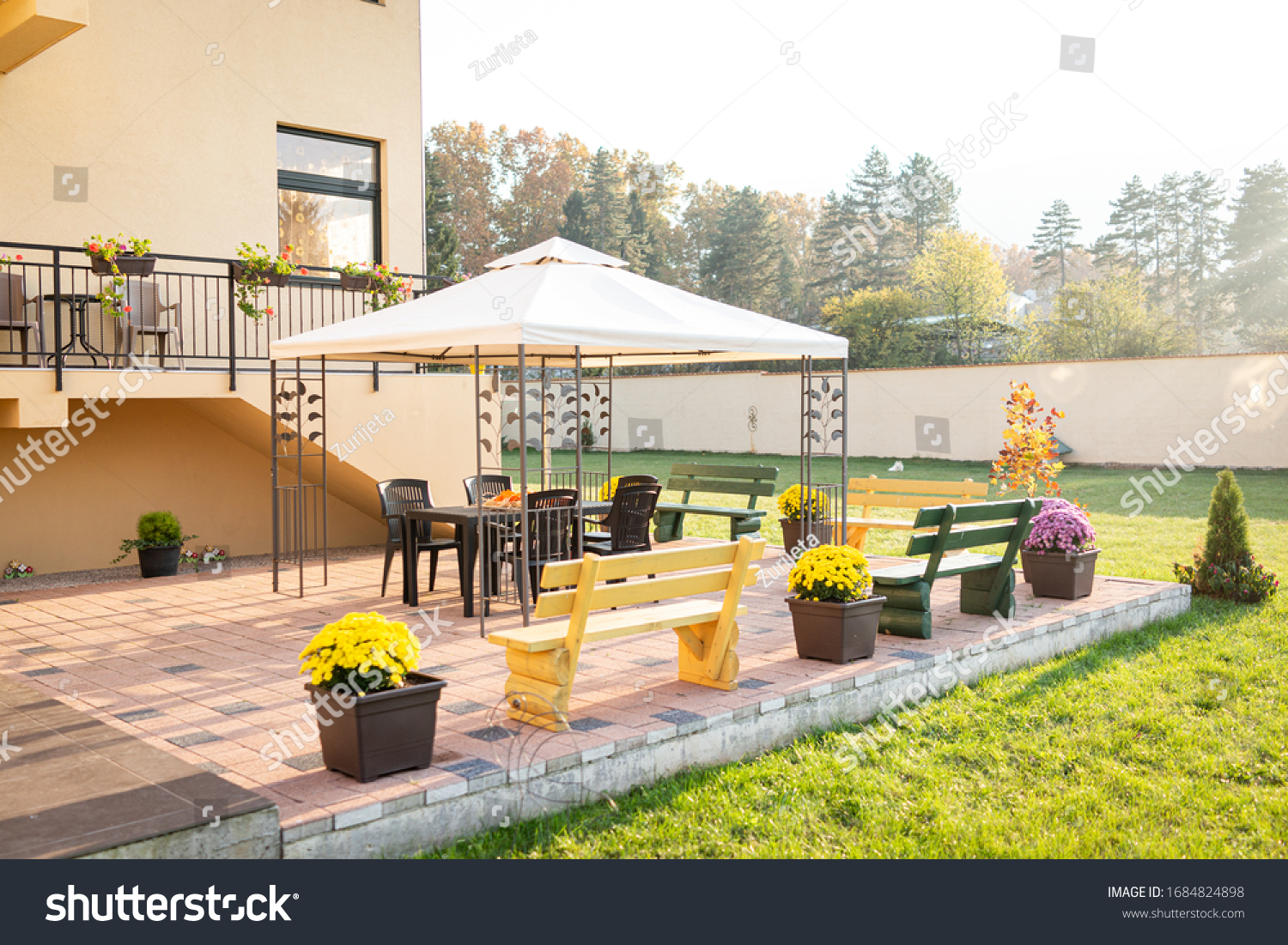 Patio with garden furniture and parasol #1684824898