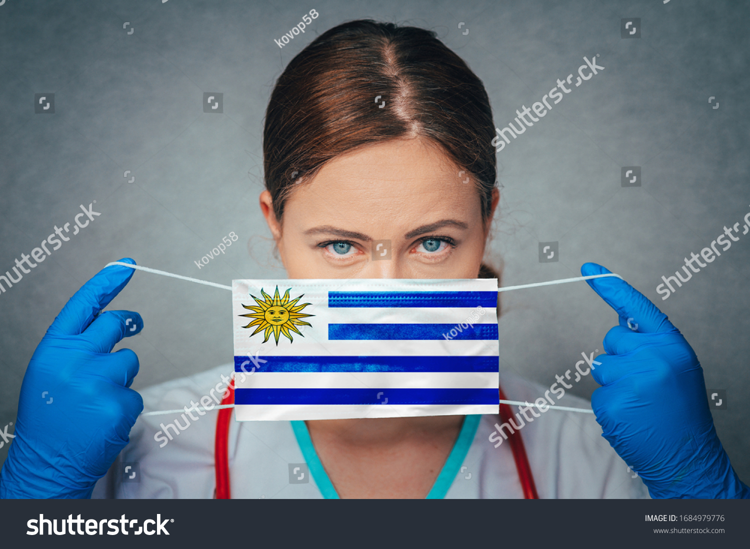 Coronavirus in Uruguay Female Doctor Portrait hold protect Face surgical medical mask with Uruguay National Flag. Illness, Virus Covid-19 in Uruguay, concept photo #1684979776