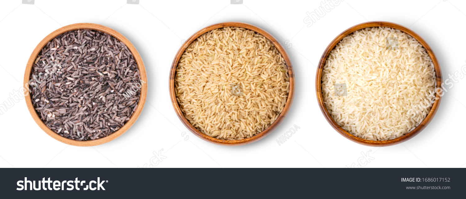 Various type and color of rice ;  riceberry, brown coarse rice and white thai jasmine rice in wooden bowl isolated on white background. Healthy food concept. Flat lay. Top view. #1686017152