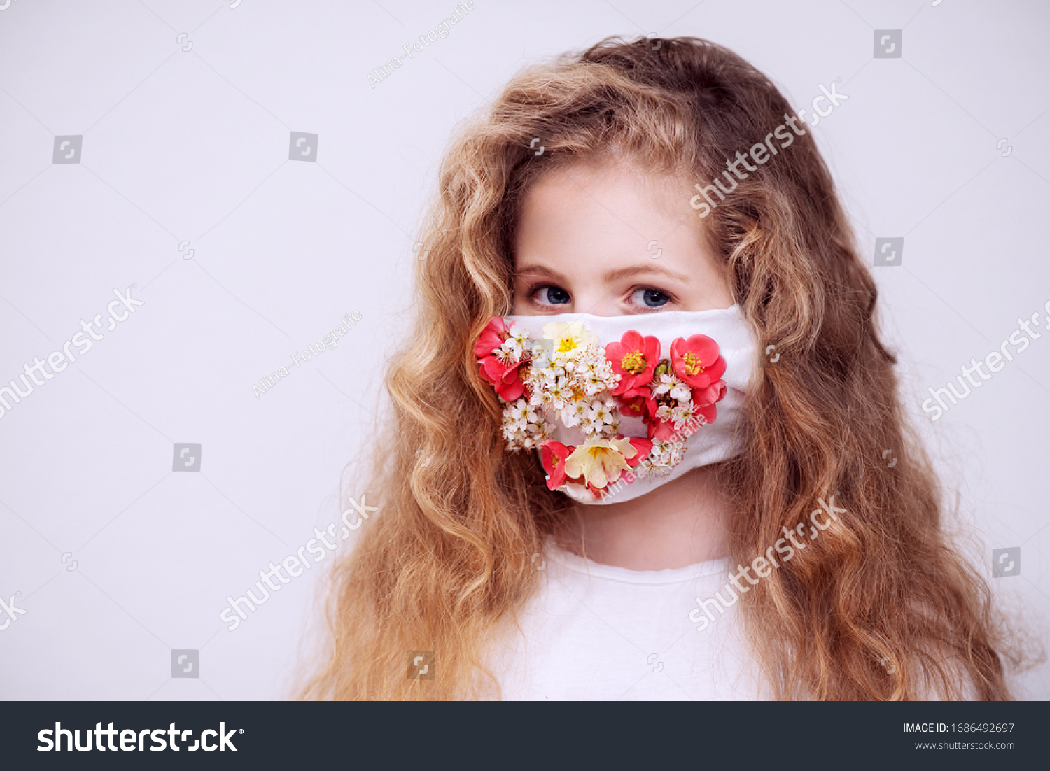A girl with a respirator. The mask is decorated with flowers. #1686492697