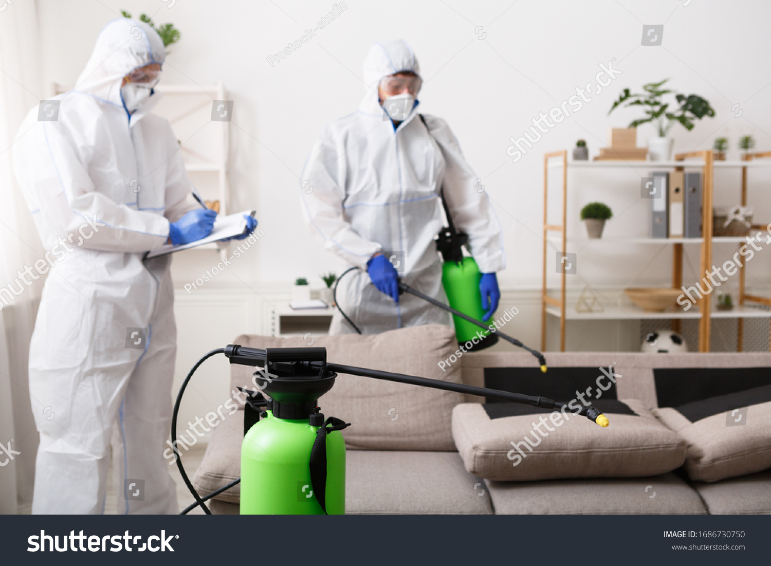 Anti coronavirus disinfection. Men in hazmat suits cleaning home, epidemic, quarantine #1686730750