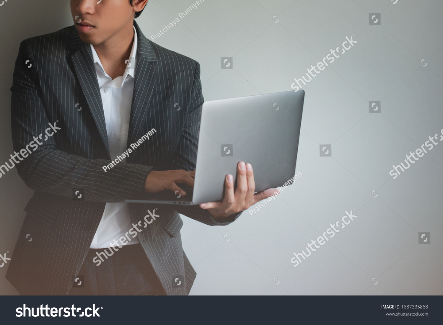 Asia Men Businessperson Think Working  Laptop At Office  Gray Background #1687335868