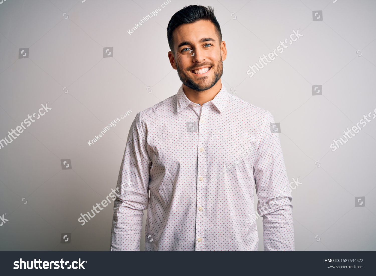 Young handsome man wearing elegant shirt standing over isolated white background with a happy and cool smile on face. Lucky person. #1687634572