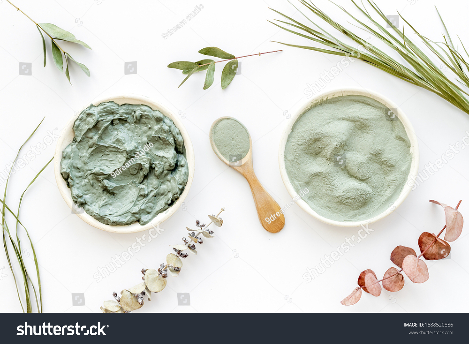 Blue cosmetic clay - face and body skin care - on white background top-down #1688520886