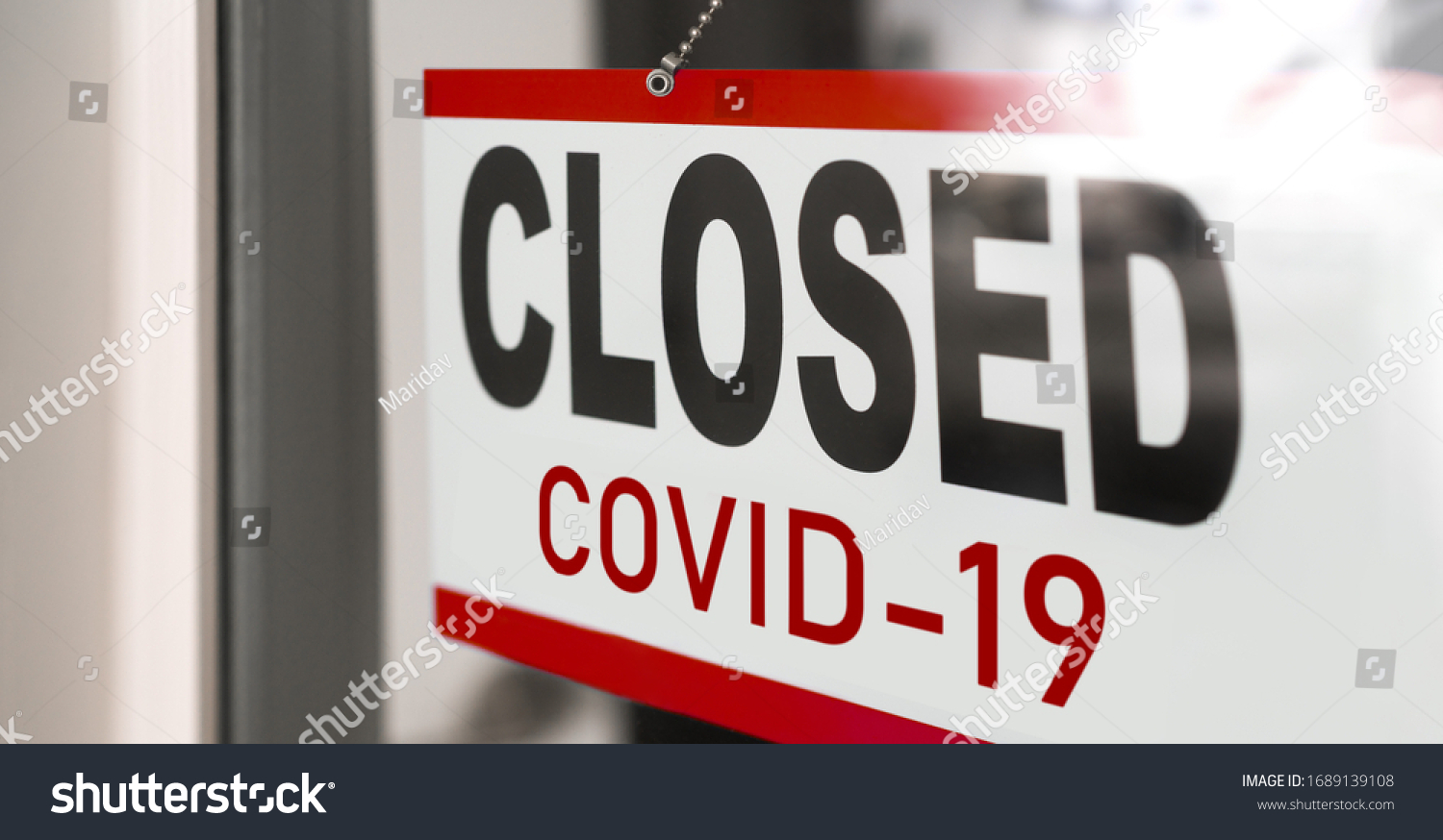 Closed businesses for COVID-19 pandemic outbreak, closure sign on retail store window banner background. Government shutdown of restaurants, shopping stores, non essential services. #1689139108