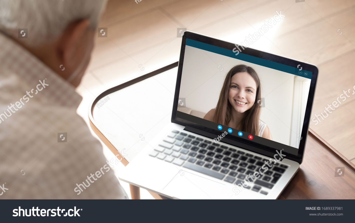 Back view of senior dad have pleasant online conversation on modern laptop with millennial daughter, mature man father talk speak on video call with female relative, use Webcam on computer #1689337981