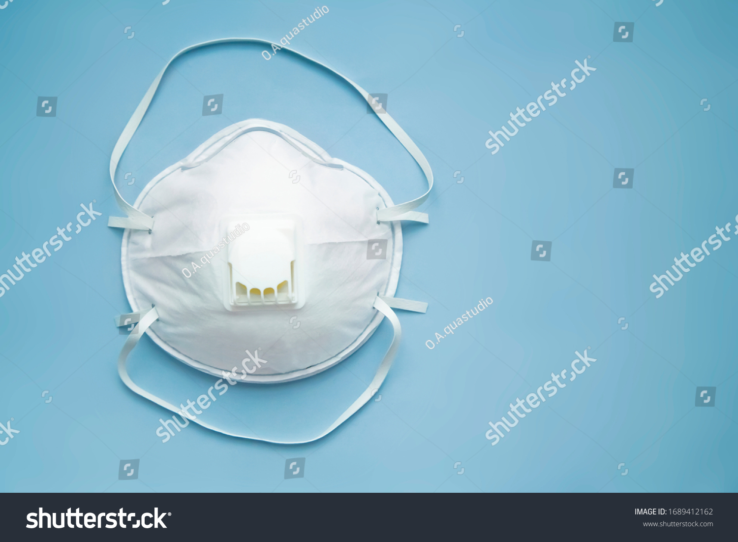 White face medical mask against virus, flu and coronavirus isolated on light blue background #1689412162