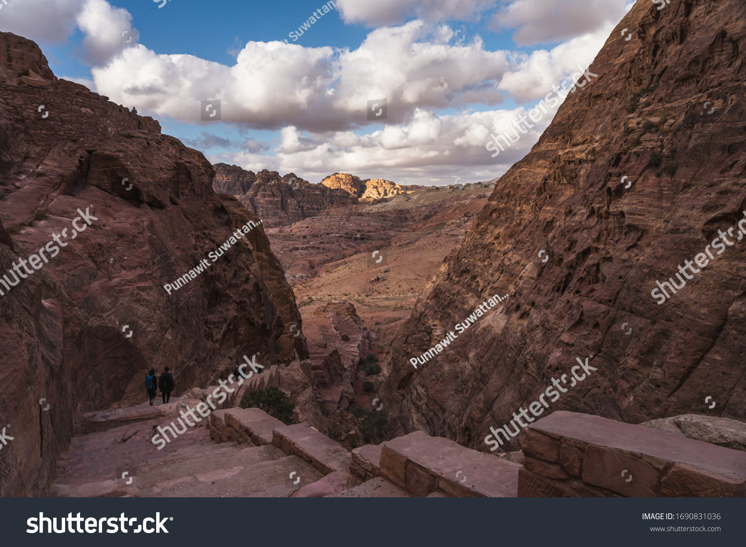 Stone stair of Al Khubta trail lead to top view of The Treasury in Petra ruin and ancient city in Jordan, Asia #1690831036