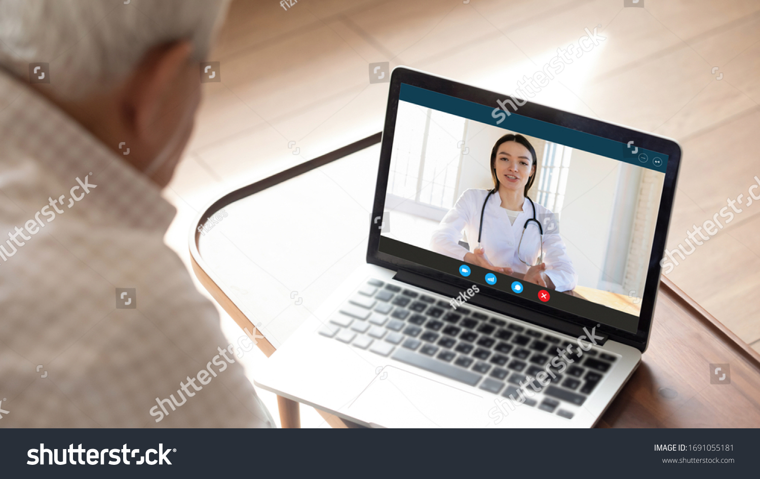 Close up of mature man have video call consult with female nurse using laptop webcam, elderly male patient sit at home talk speak with doctor or physician, discuss symptoms with gp on computer online #1691055181