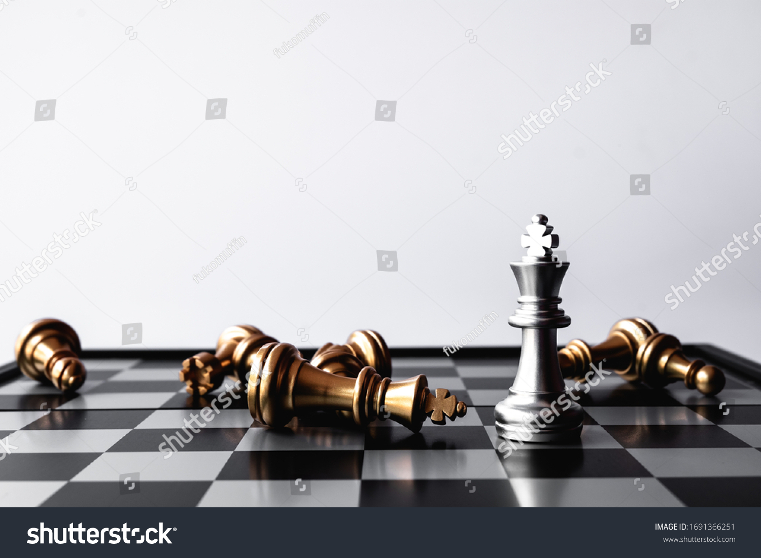 A chess king last stand as a true winner.Money game concept. Copy space. #1691366251