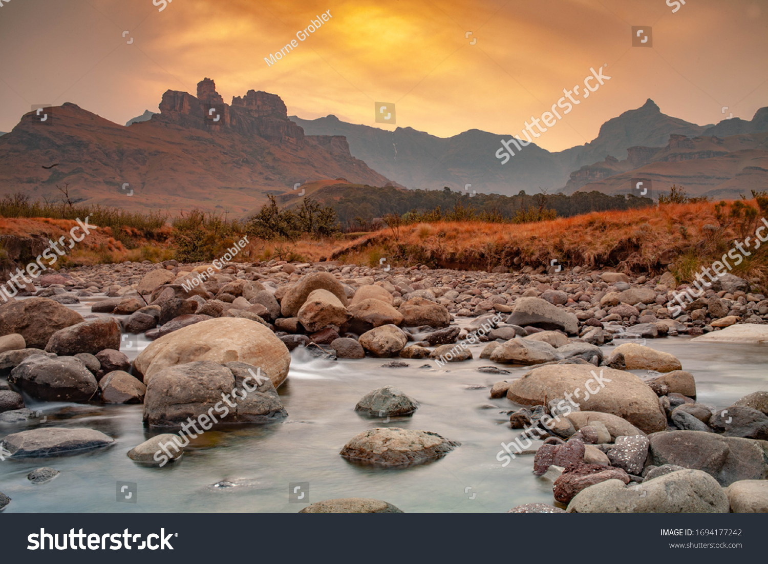 Drakensberg Sunset with a stream in the foreground  #1694177242