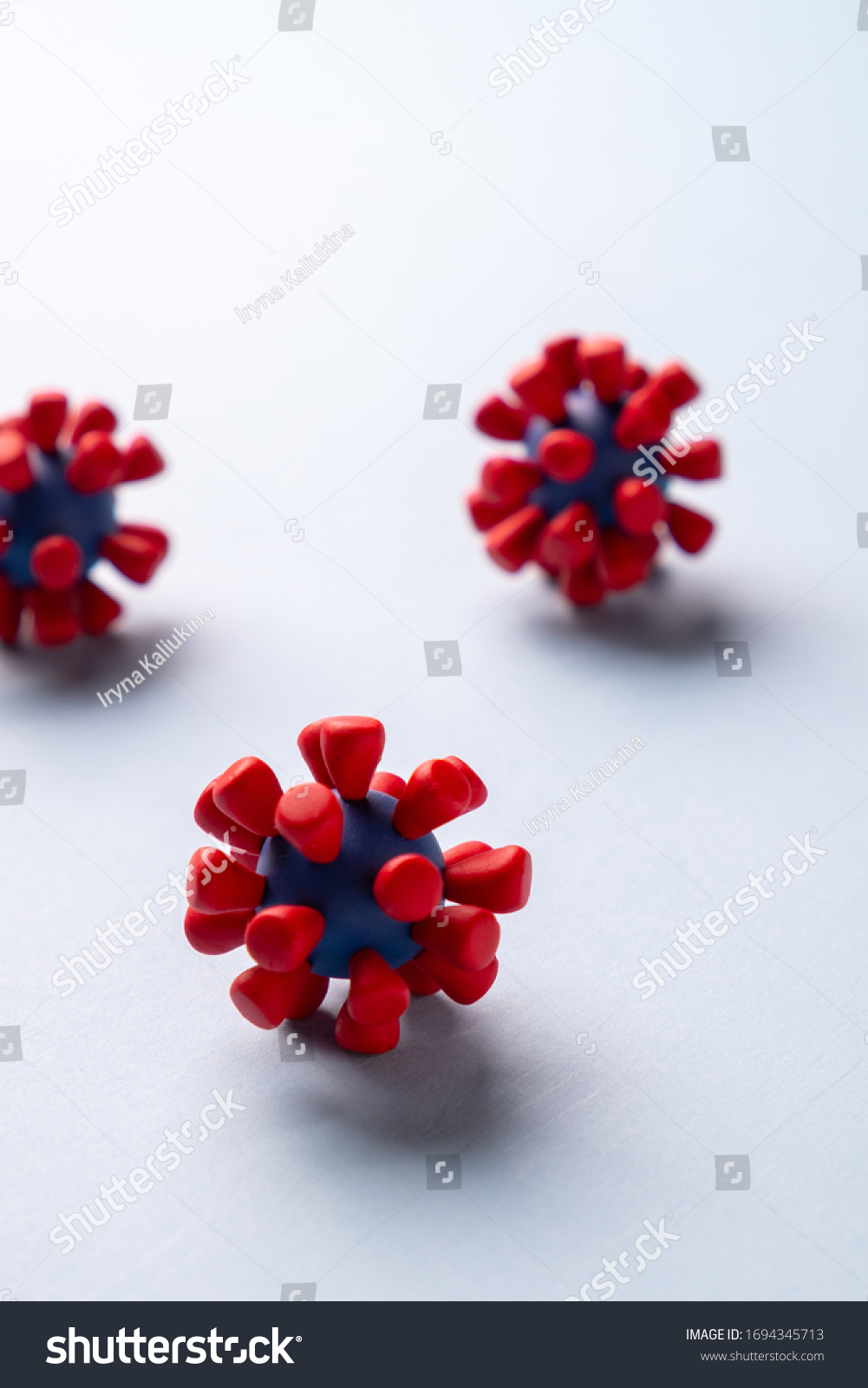 Plasticine model  of coronavirus bacteria 
or  other virus  on blue background. Place fo text
 #1694345713
