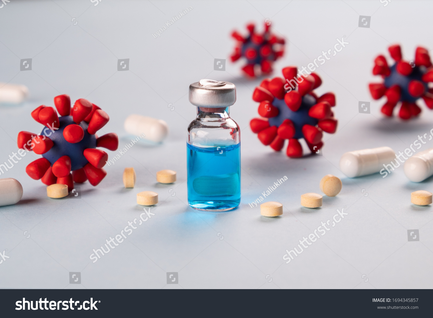 COVID-19,Coronavirus concept. Medication for treatment and prevention of new corona virus infection,  and models of covid-19 virus on blue background. #1694345857