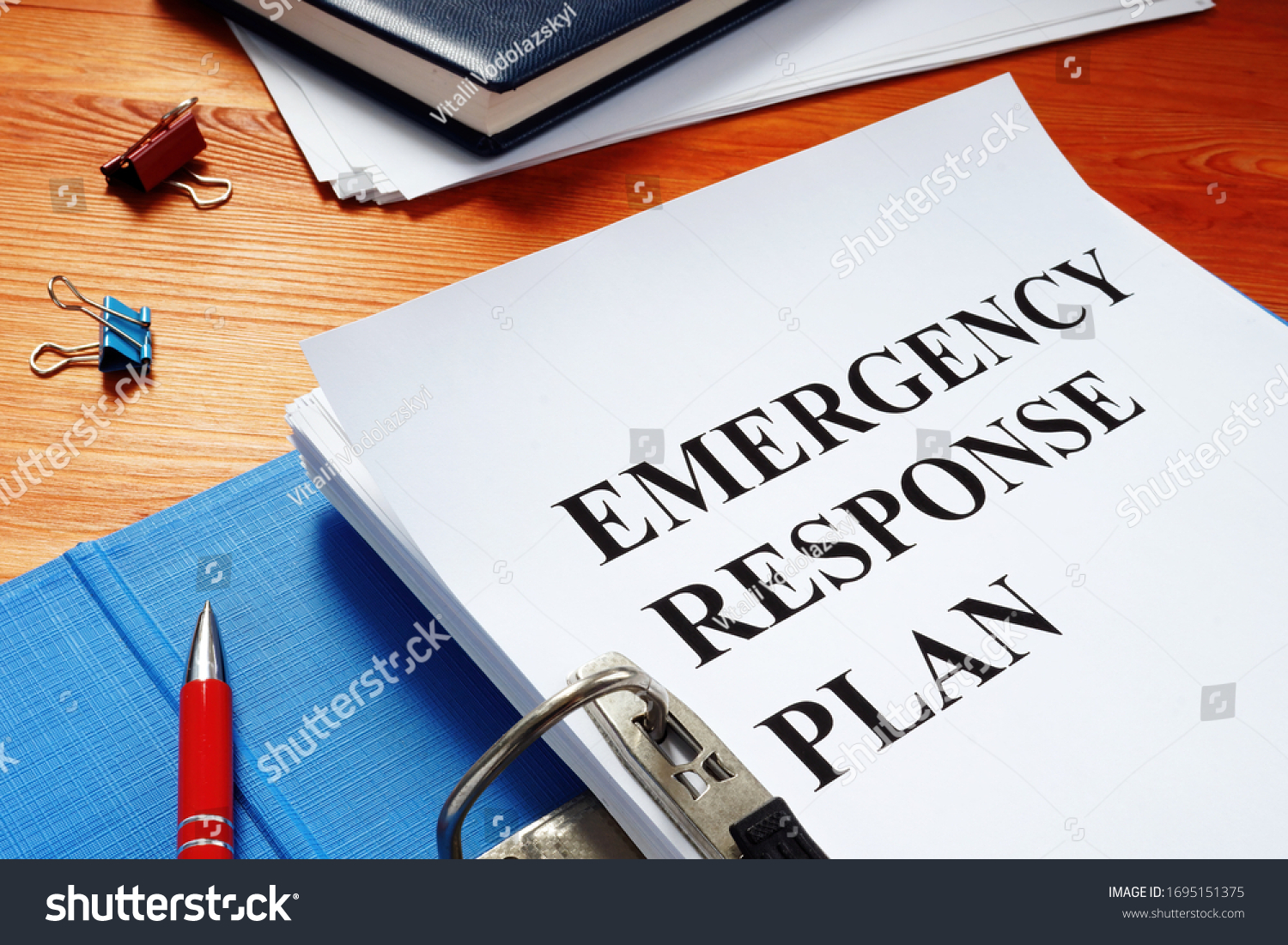 Open folder with Emergency response plan. #1695151375