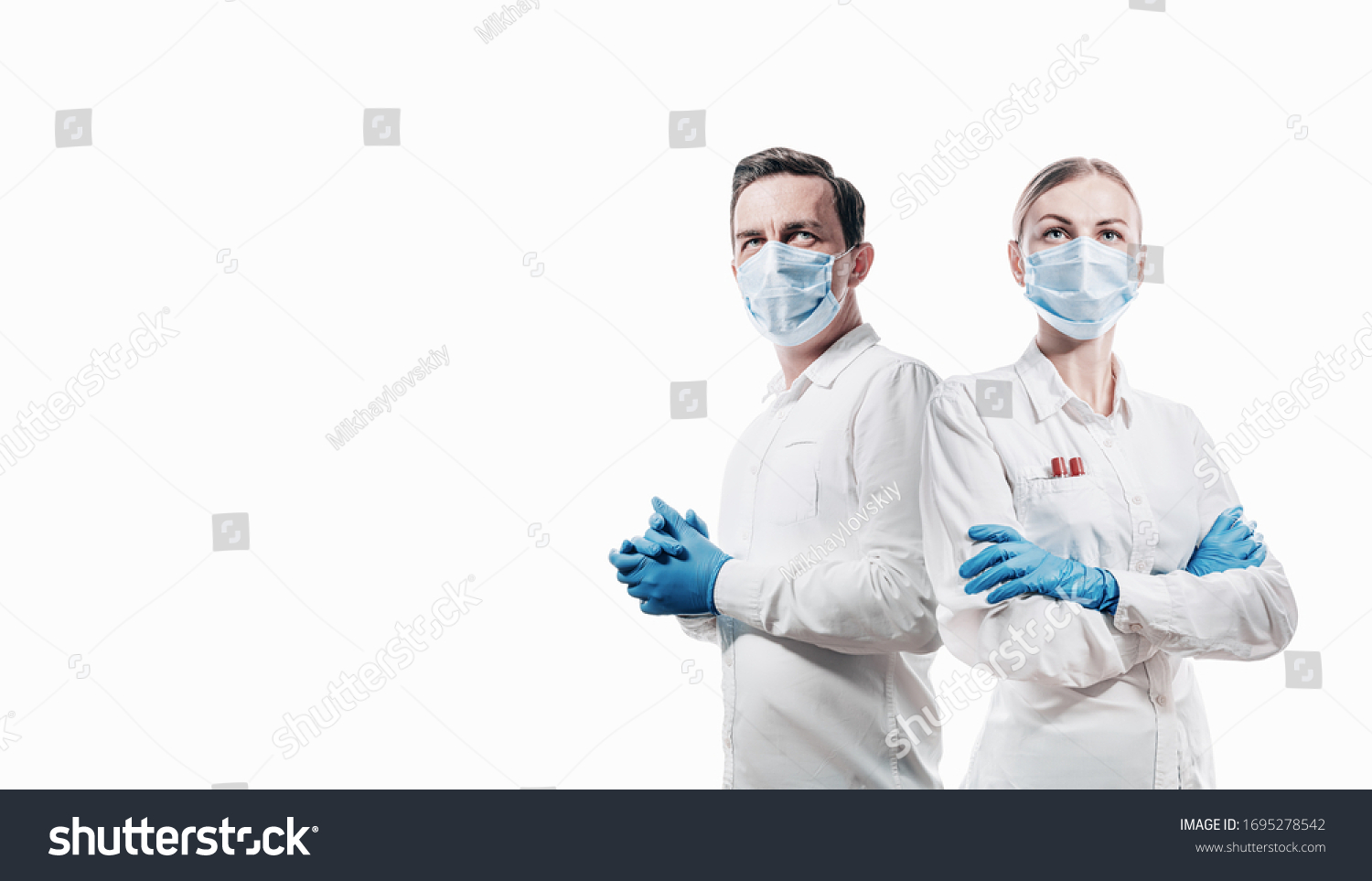 doctors man and woman on a white background in medical masks on the face #1695278542