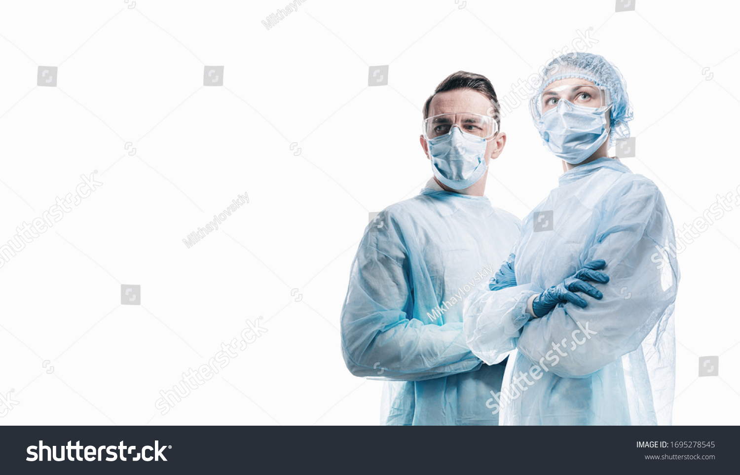 doctors man and woman on a white background in medical masks on the face #1695278545