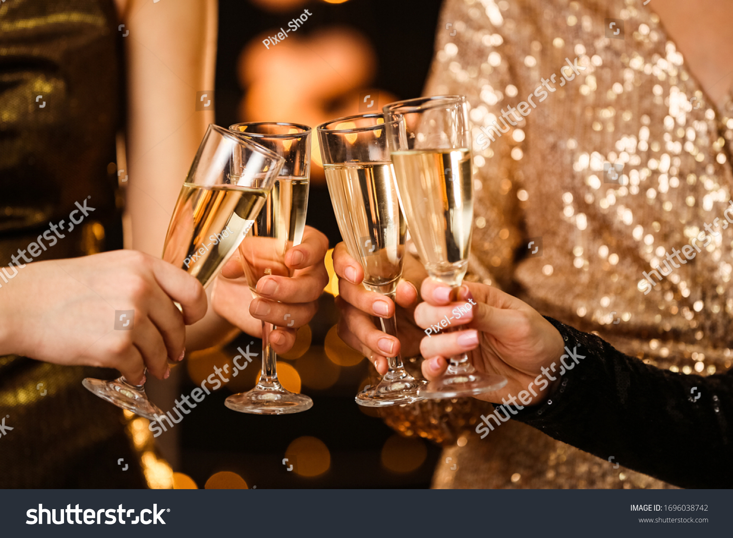 Women clinking glasses of tasty champagne at party #1696038742