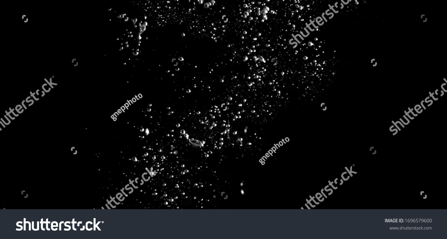 Blurry images of real soda bubbles floating and splashing up in black background which represent freshness of carbornate drink or sparkling water and shoot from realistic water moving not 3D making #1696579600
