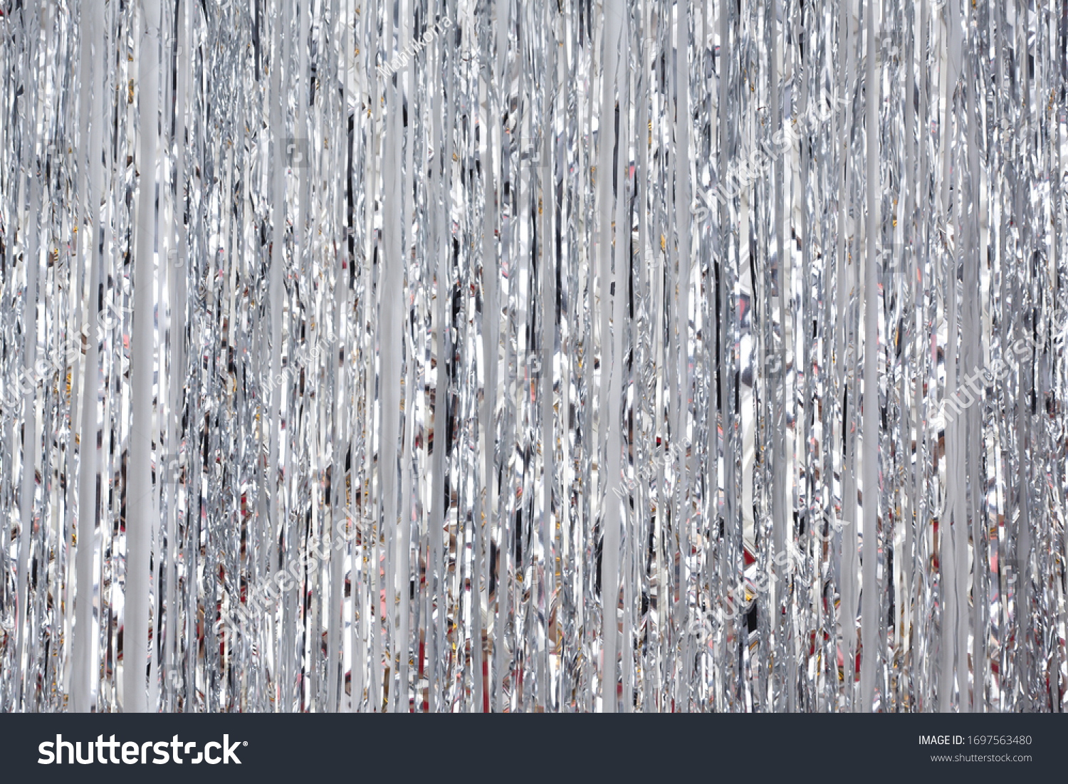 Christmas, New Year background and texture. Silver tinsel or shiny ribbons

 #1697563480